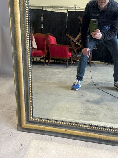 Large beveled mantelpiece mirror in gilded...