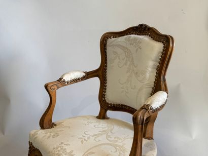 Wooden child's armchair, white silk studded...