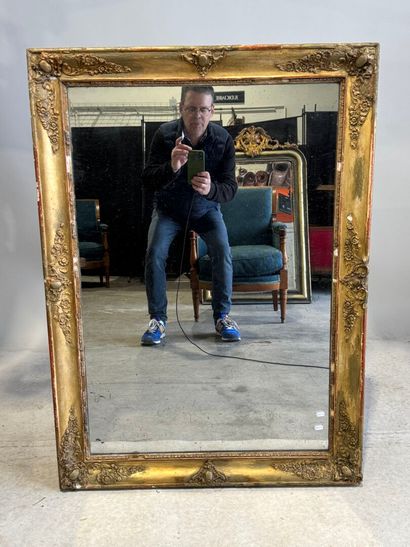 Rectangular wood and gilded stucco mirror...