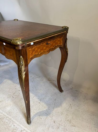 Wooden game table with cubes and foliate...