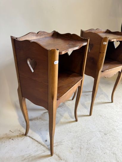 Pair of molded wood bedside tables with a...