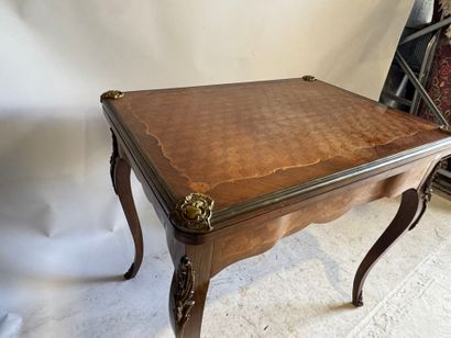 Wooden game table with cubes and foliate...