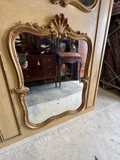 Trumeau in molded, carved, gilded and beige...