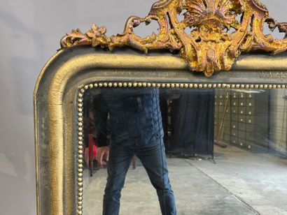 Large beveled mantelpiece mirror in gilded...