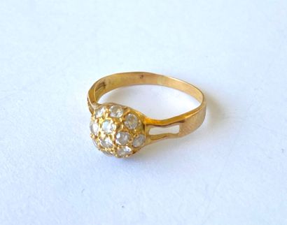 Yellow gold ring with a ball design adorned...