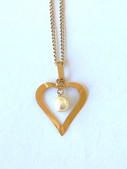 Yellow gold neck chain adorned with an openwork...