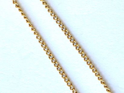 Yellow gold neck chain adorned with an openwork...