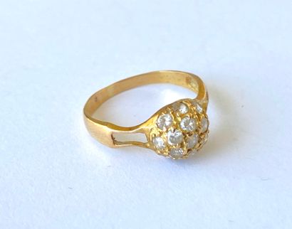 Yellow gold ring with a ball design adorned...