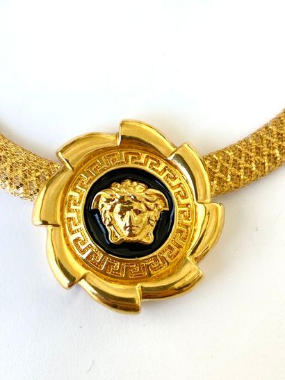 Yellow gold and black enamel half-set decorated...