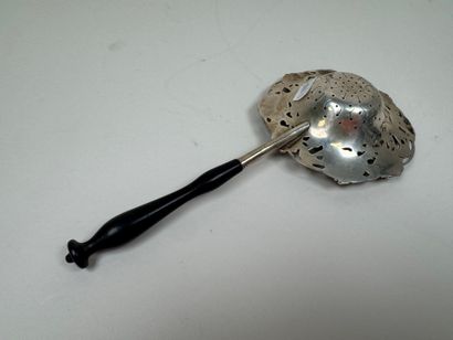Large foreign silver tea strainer with repoussé...