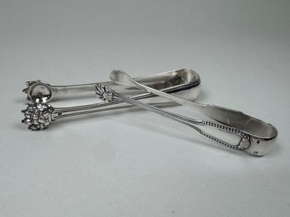 Two 950/1000 silver sugar tongs, fillet pattern,...