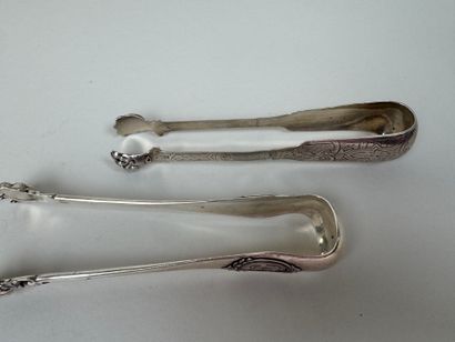 Four sugar tongs in 950/1000 silver, claw...