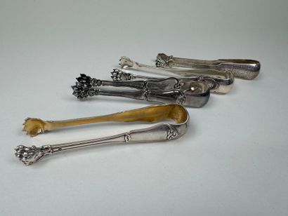 Four sugar tongs in 950/1000 silver, claw...