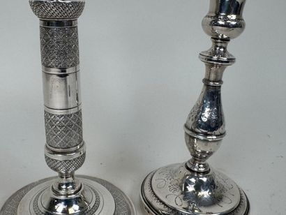 Deux bougeoirs en bronze et métal argent...