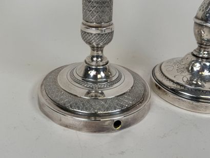 Deux bougeoirs en bronze et métal argent...