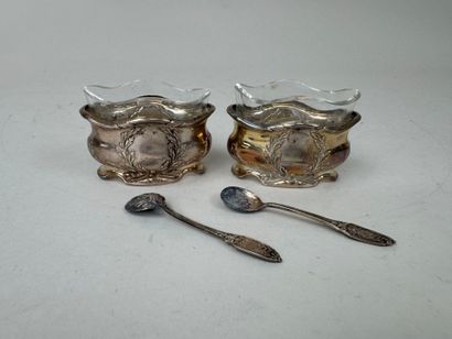 A pair of 950/1000 repoussé silver salerons...