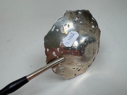 Large foreign silver tea strainer with repoussé...
