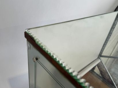 Small two-door cabinet made of wood with...
