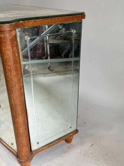 Small two-door cabinet made of wood with...