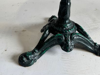 Bistro table with a wrought-iron tripod base...