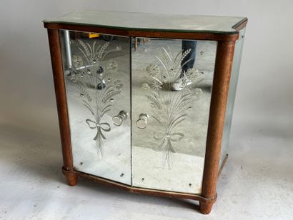 Small two-door cabinet made of wood with...