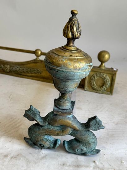 Pair of bronze andirons decorated with stylized...