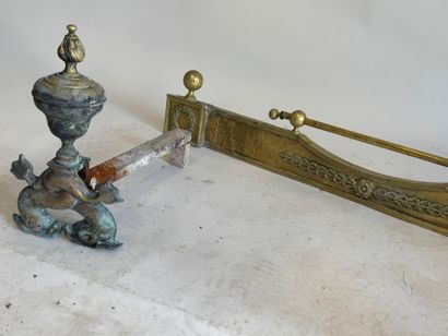 Pair of bronze andirons decorated with stylized...