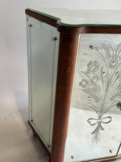 Small two-door cabinet made of wood with...