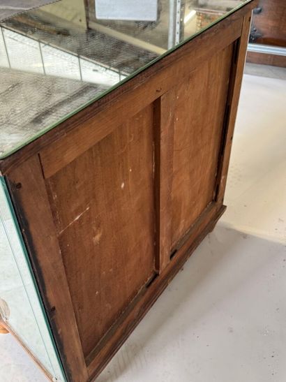 Small two-door cabinet made of wood with...
