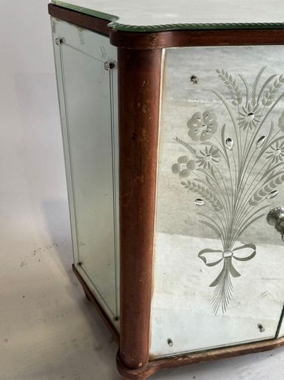 Small two-door cabinet made of wood with...