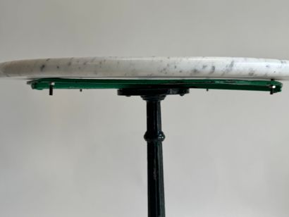 Bistro table with a wrought-iron tripod base...