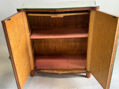 Small two-door cabinet made of wood with...
