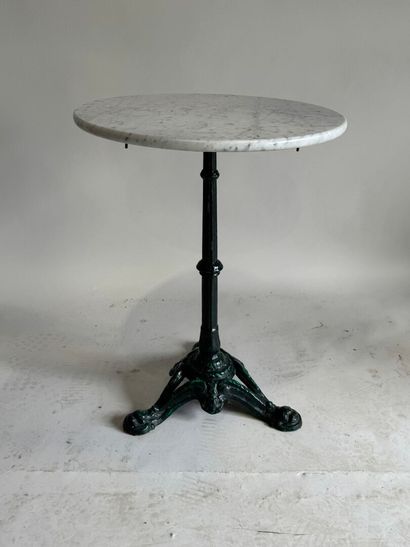 Bistro table with a wrought-iron tripod base...