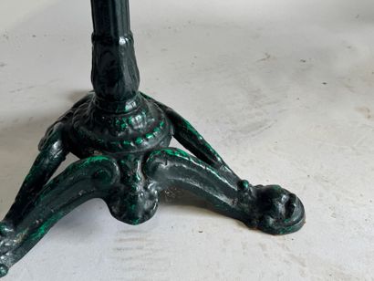 Bistro table with a wrought-iron tripod base...