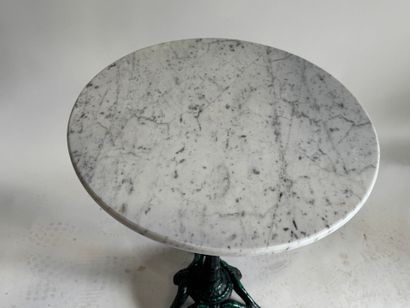 Bistro table with a wrought-iron tripod base...