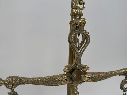 A chiseled bronze apothecary's balance scale...
