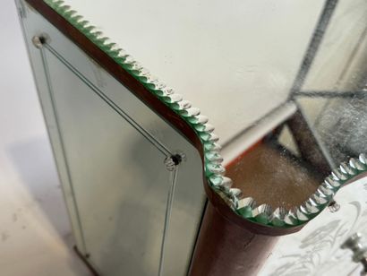 Small two-door cabinet made of wood with...