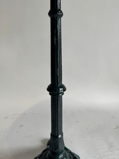 Bistro table with a wrought-iron tripod base...