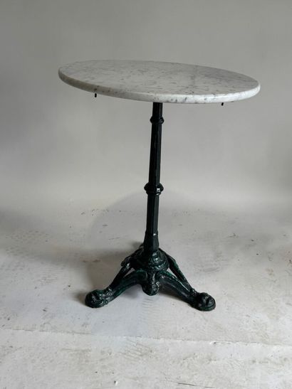 Bistro table with a wrought-iron tripod base...