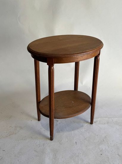 Wooden oval pedestal table, tapered and fluted...