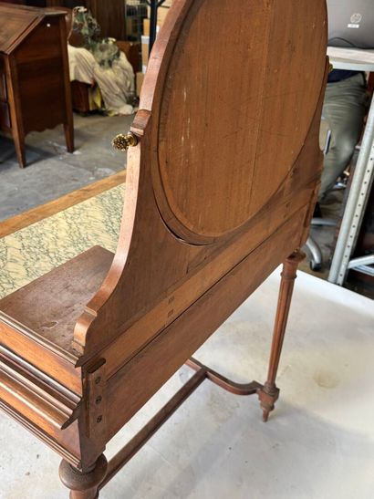 Walnut dressing table with an oval mirror,...