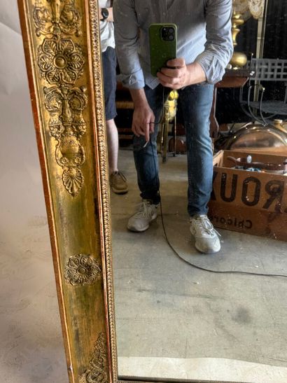 Large wooden mirror with stuccoed and gilded...