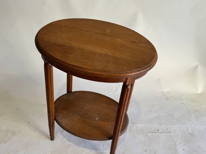 Wooden oval pedestal table, tapered and fluted...