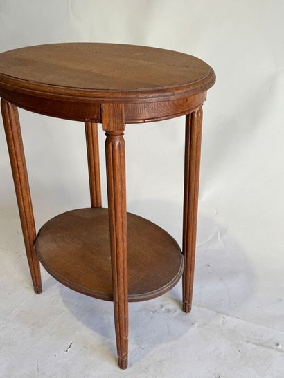 Wooden oval pedestal table, tapered and fluted...