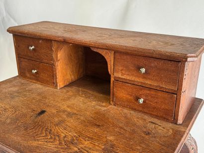 Stepped oak desk with four drawers and a...