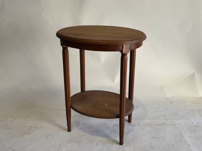 Wooden oval pedestal table, tapered and fluted...
