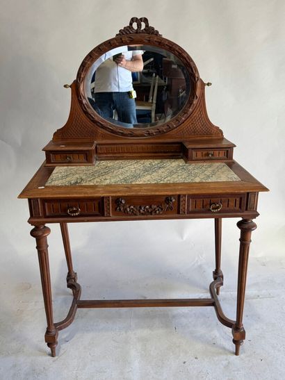 Walnut dressing table with an oval mirror,...