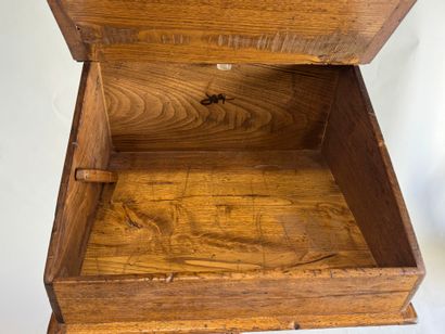 Wooden lectern opening to a flap forming...