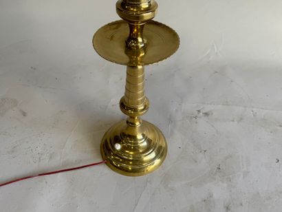 Gold-plated brass candlestick mounted as...