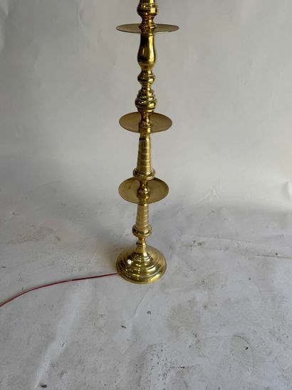 Gold-plated brass candlestick mounted as...
